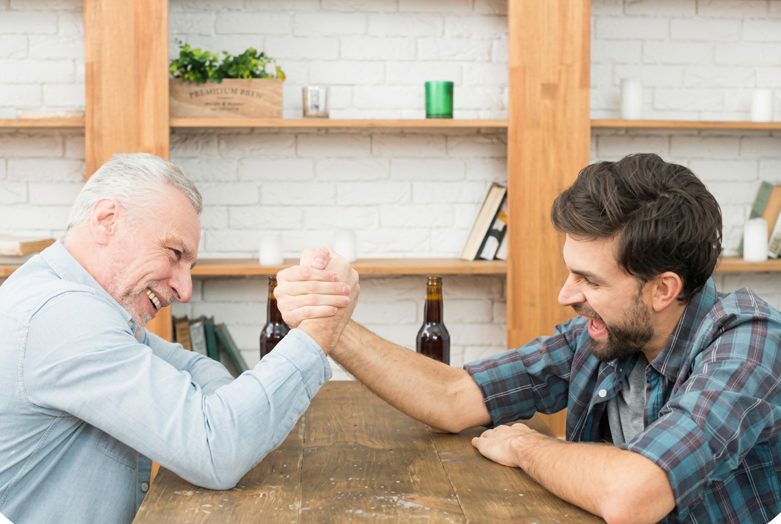Support worker coaching a client at a kitchen table